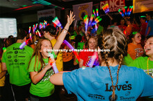 Students participating in a "Rave" by twirling their light sticks around. 1274 Nebraska students sig