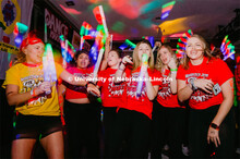 Students participating in a "Rave" by twirling their light sticks around. 1274 Nebraska students sig