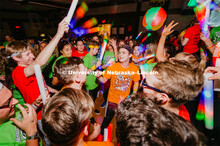 Students participating in a "Rave" by twirling their light sticks around. 1274 Nebraska students sig
