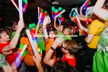 Students participating in a "Rave" by twirling their light sticks around. 1274 Nebraska students sig
