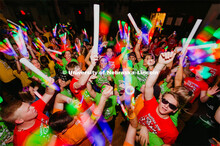 Students participating in a "Rave" by twirling their light sticks around. 1274 Nebraska students sig