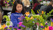 A student completes a spray during Stacy Adams floral design class. Hort 261- Floral Design 1, in Pl