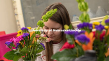 A student completes a spray during Stacy Adams floral design class. Hort 261- Floral Design 1, in Pl