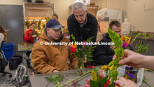 Stacy Adams (center), associate professor of practice in agronomy and horticulture, helps two studen