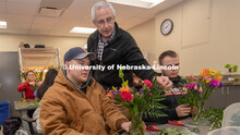 Stacy Adams (center), associate professor of practice in agronomy and horticulture, helps two studen