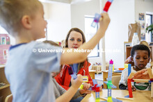 Monica Meyer, senior in Inclusvie Child Youth and Family Studies, works with children at the Malone 