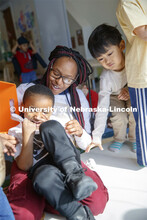 DaVon Jackson, an instructor at the Malone Center, works with a group of children Thursday morning. 