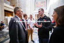 Chancellor Ronnie Green speaks with ASUN President Hunter Traynor and other UNL students in the capi
