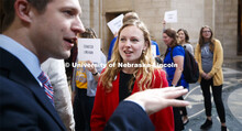 Emily Johnson, ASUN Internal Vice President, talks with Senator Adam Morfeld in the rotunda. NU Advo