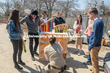 Lincoln Children's Zoo giraffe keeper Nikki Shemanski (left) talks with students (from left) Pin Hao