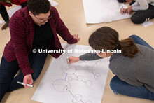 Grace Stallworth (right), project coordinator for Worlds of Connections, plays a network science gam