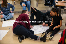 Grace Stallworth (right), project coordinator for Worlds of Connections, plays a network science gam