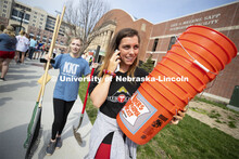 Brooklyn Housh calls her team as she and Kennedy Wolfe carry supplies from the Coliseum. More than 2