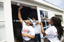 Nebraska's Iesha Bryant reaches for the top of the doorway as she and others in the Minority Pre-Hea
