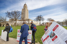 Nichole Brady and Brooke Mott talks as they carry their Homerathon poster from the Ferguson House to