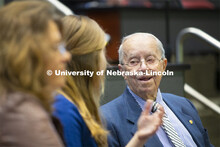 Keith Heuermann talks with others before the Heuermann Lecture. This public lecture series in the In
