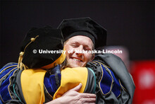 Patrick Janike hugs his advisor Lorraine Males after he received his doctor of education hood. 2019 