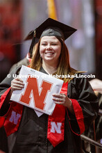 Morgan Krause smiles at family and friends after receiving her College of Business diploma. Undergra