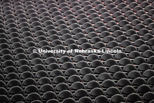 The chairs are neatly lined up for the graduates. Undergraduate commencement at Pinnacle Bank Arena,