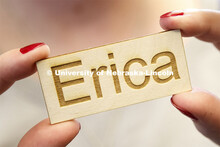 Erica Rogers with the Hastings library shows off her name tag produced by the laser cutter. Library 
