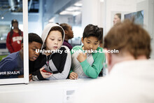 Students on a field trip interact with zoologists in Morrill Hall's Visual Lab on the museum's fourt