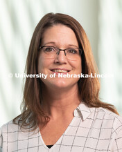 Studio portrait of Nicole Wood, Office Associate at CAPS (Counseling and Psychological Services. May