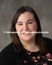 Studio portrait of Carly Mendoza, Administrative Coordinator for First Year Experience and Transitio