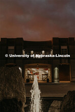The Nebraska Union on City Campus is lit up early in the morning with the sunrise in the background.