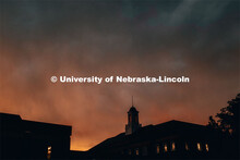 Love Library and its cupola are silhouetted against the morning sunrise. July 10, 2019. 