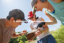 Jessica Corman, assistant professor in the School of Natural Resources, discusses a rock teaming wit