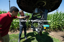 Frank and Dave discuss how they might mount a camera to the spidercam. Frank Bai, Research Professor