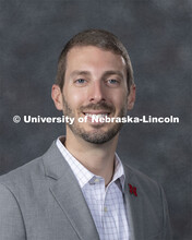 Studio portrait of Nathan Koch, Assistant Professor of Bassoon and Music Theory, Hixson-Lied College