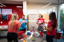 East campus residents from Massengale Hall craft wall hangings and make fruit on a kebobs, meeting o