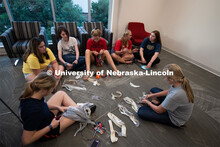 East campus residents from Massengale Hall craft wall hangings and make fruit on a kebobs, meeting o