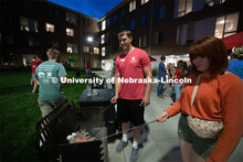 East campus residents from Massengale Hall play yard games, roast marshmallows for smores, meeting o