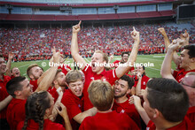 Sam Brown, an alto saxophone player from Omaha, celebrates with fellow band members after winning th