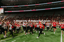 Student making a catch and the team going wild, she was the only one to catch the ball. Students got