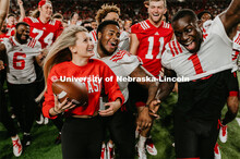 Student making a catch and the team going wild, she was the only one to catch the ball. Students got