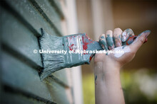 First year law students, faculty and staff paint two Lincoln houses. The painting is a yearly tradit