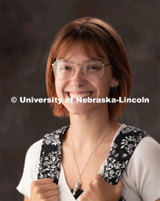 Studio portrait of Macy Behrens, junior graphic design major. Student worker for University Communic