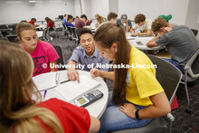 Justin Nguyen helps Leavitt Reno, freshman from Grand Island, during Calculus 106 recitation in Loui