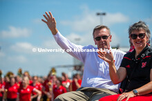Ronnie and Jane Green waving to parade patrons. The University of Nebraska represents and celebrates
