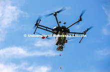 Carrick Detweiler and crew flies the Drone Amplified Ignis drone system which drops ball that ignite