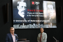 Daniel Claes, department chair and professor of Physics and Astronomy, demonstrates how light bends 