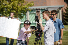 Students in THEA 426 - Lighting for Film, practice lighting techniques while shooting outside the vi