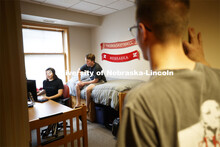 Students hanging out in a Kauffman Academic Residential Center dorm room. Raikes school photo shoot.
