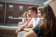 Students hanging out on the roof of the Kauffman Academic Residential Center. Raikes school photo sh