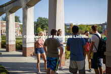 Students hanging out front of the Kauffman Academic Residential Center. Raikes school photo shoot. S