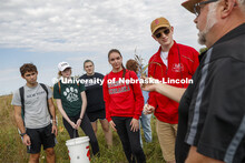 Dave Wedin talks with students about plants found on the prairie. Natural Resources 101 course learn