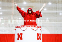 Chancellor Ronnie Green wearing the robe of the Innocents pops out of the N150 birthday cake. Showti